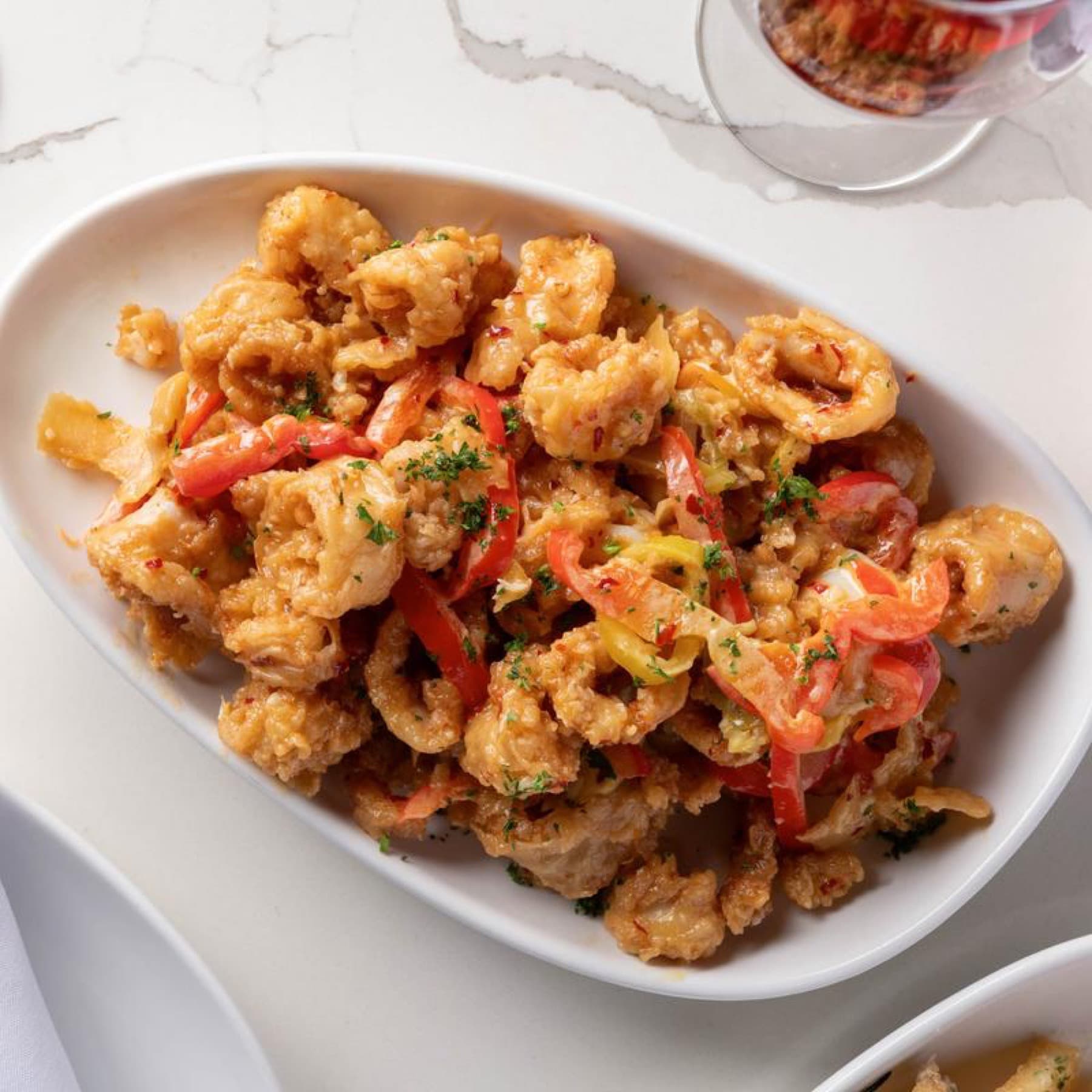 Italian pasta dish plated with tomato sauce