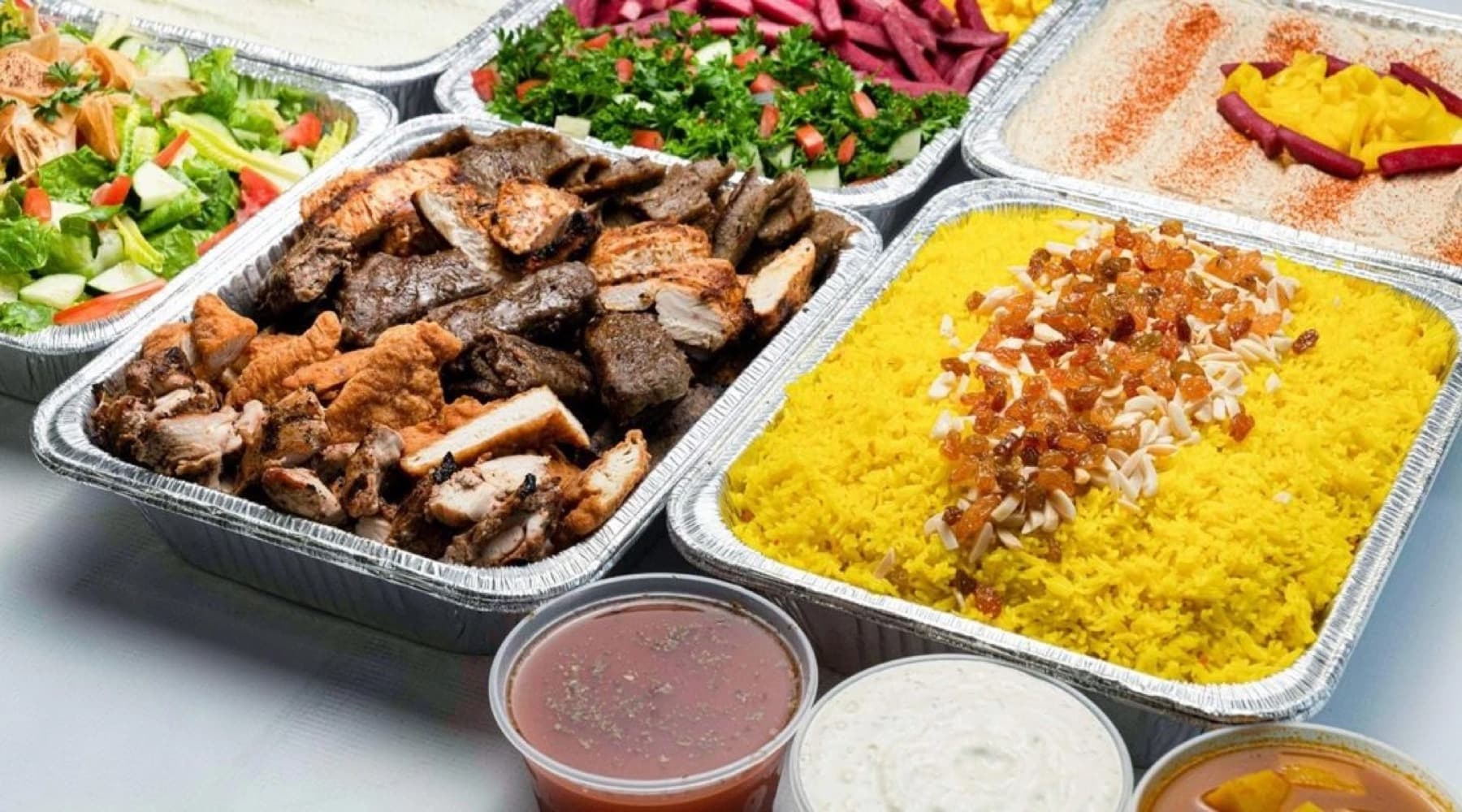 Mediterranean platter with chicken, rice, and vegetables